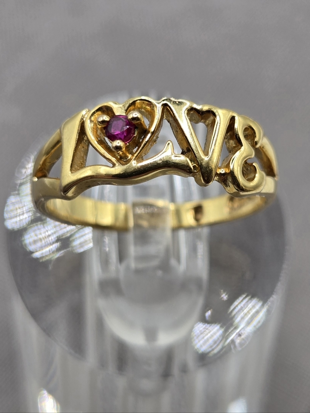 Gold Love Script Ring with Pink Gem